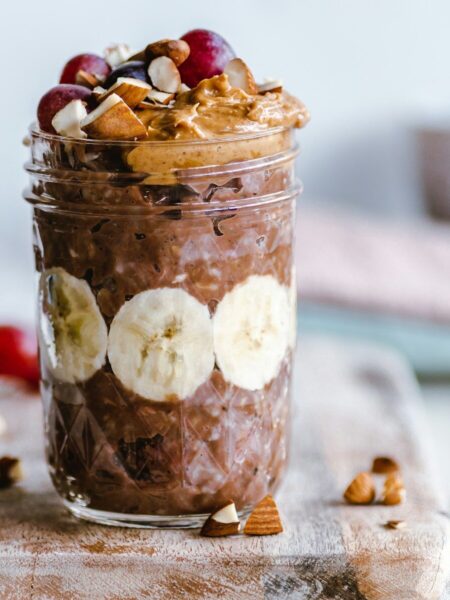 fruits and cream in clear glass cup