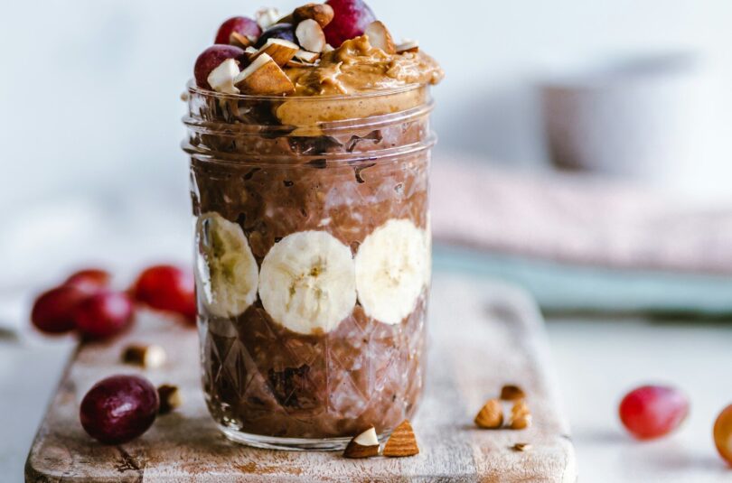 fruits and cream in clear glass cup