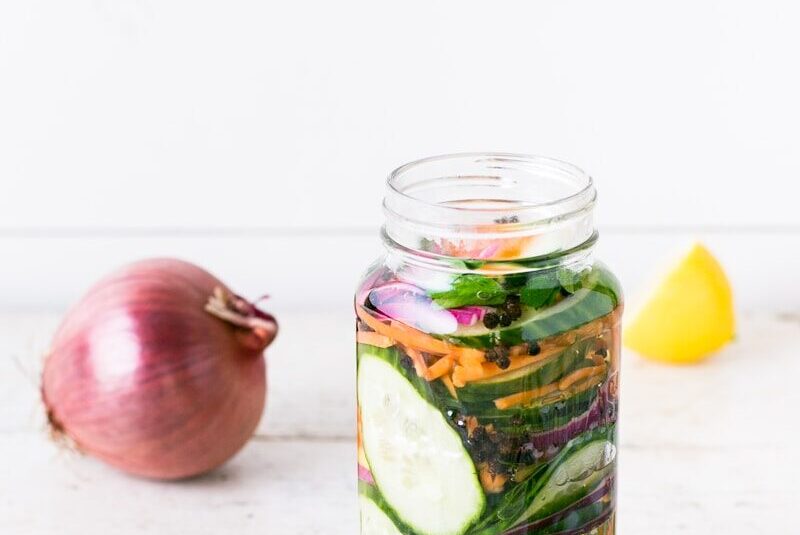 clear glass bottle on white table